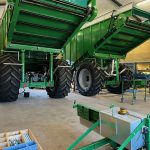 Rear of a GreenLoader inside a workshop, with the body raised.