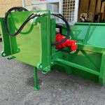 Side view of a PowerWinch with a red hydraulic motor, blade and support legs.
